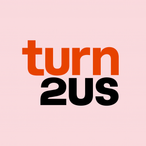 a picture of a logo - red and black writing saying turn 2 us
